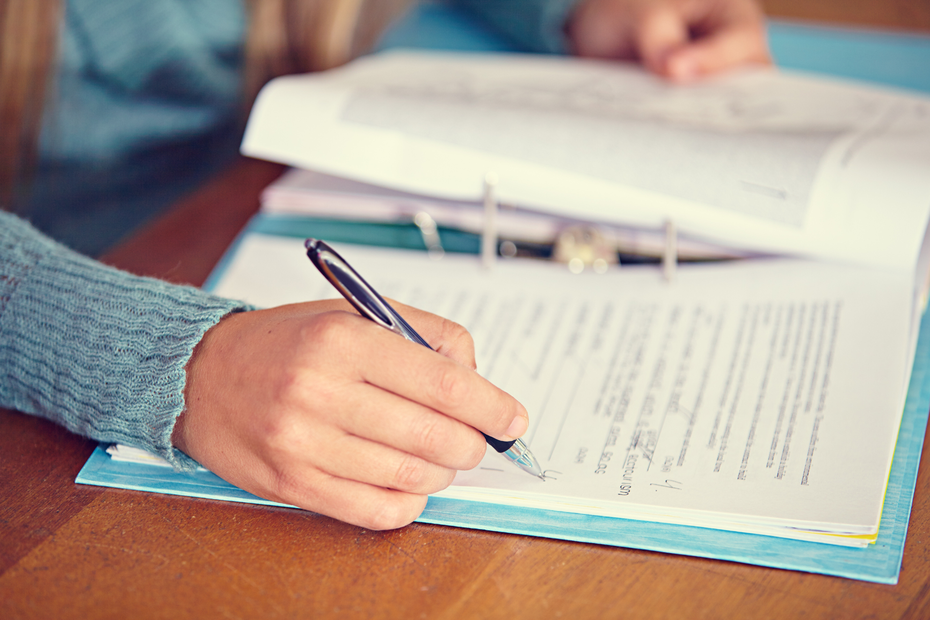 person with workbook